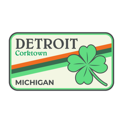 Rectangular sign with 'Detroit Corktown Michigan' text and a green four-leaf clover on a white background
